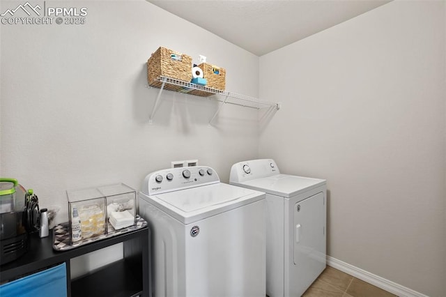 11052 Bossett Dr, Peyton, CO 80831 - washroom with washer and dryer, light tile patterned flooring, and baseboards
