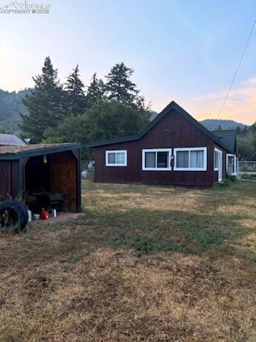 245 Lower Glenway St, Palmer Lake, CO 80133 - view of side of property featuring a yard