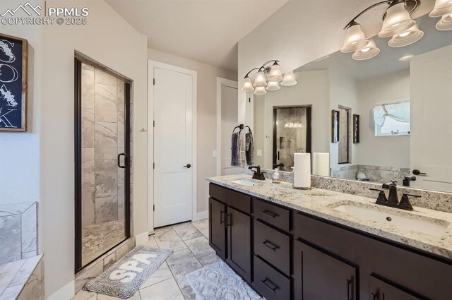 10394 Beckham St, Peyton, CO 80831 - bathroom featuring marble finish flooring, a shower stall, a chandelier, and double vanity
