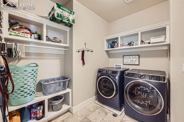 10394 Beckham St, Peyton, CO 80831 - clothes washing area with washer and clothes dryer, tile patterned floors, and baseboards