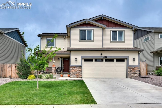 6927 Passing Sky Dr, Colorado Springs, CO 80911 - craftsman-style home featuring stone siding, an attached garage, concrete driveway, and board and batten siding