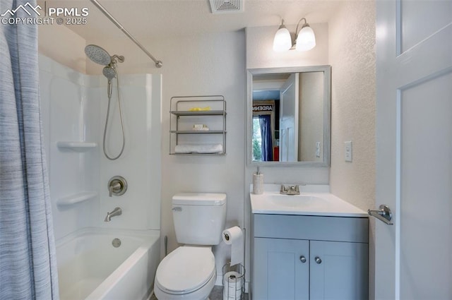 6927 Passing Sky Dr, Colorado Springs, CO 80911 - full bathroom with vanity, shower / bath combo with shower curtain, toilet, and a textured wall