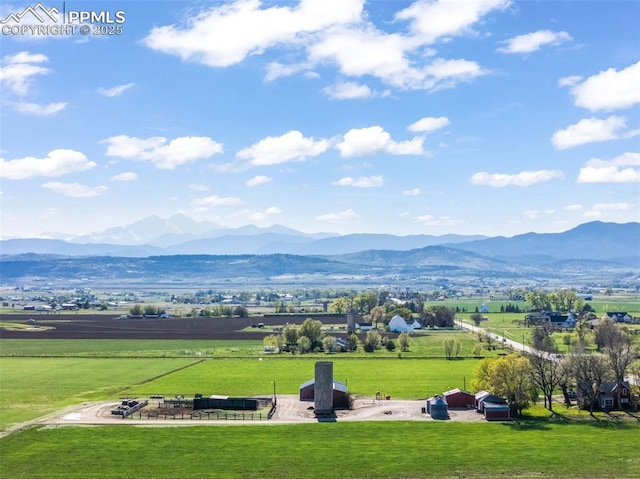 view of mountain background featuring rural landscape