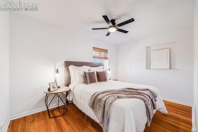 5362 S Cedar St, Littleton, CO 80120 - bedroom featuring baseboards, wood finished floors, and a ceiling fan