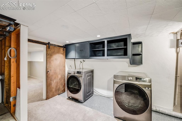5362 S Cedar St, Littleton, CO 80120 - laundry area with a barn door and independent washer and dryer