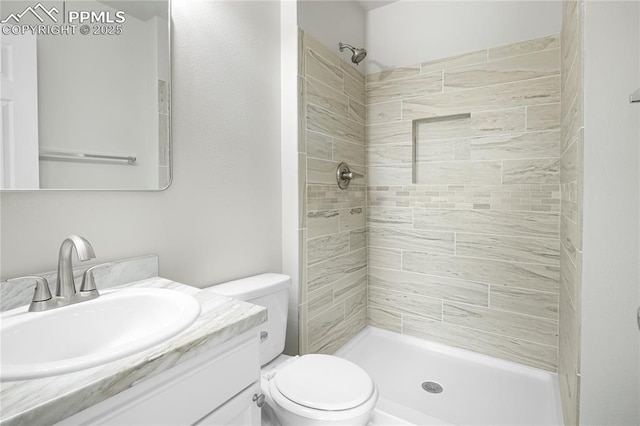 502 Fountain Mesa Rd, Fountain, CO 80817 - bathroom featuring vanity, toilet, and a tile shower