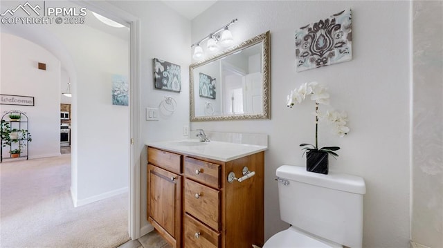 14870 Reiner Ct, Peyton, CO 80831 - bathroom with vanity, toilet, and baseboards