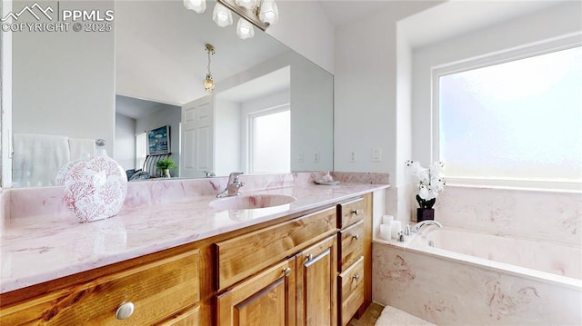 14870 Reiner Ct, Peyton, CO 80831 - bathroom with vanity, healthy amount of natural light, and a garden tub