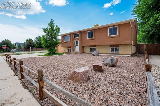 3905 Allgood Dr, Colorado Springs, CO 80911 - back of house featuring brick siding