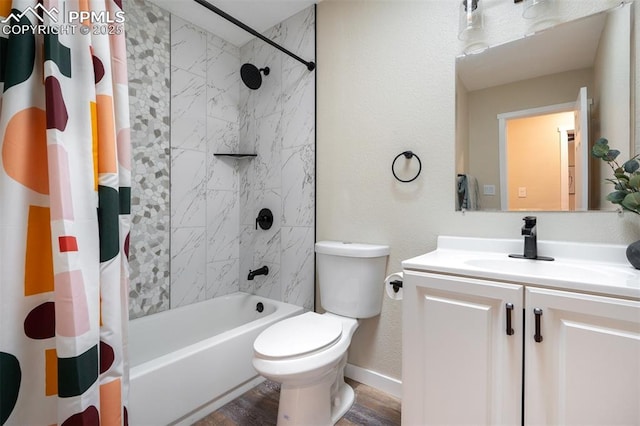 3905 Allgood Dr, Colorado Springs, CO 80911 - bathroom featuring vanity, shower / tub combo, toilet, wood finished floors, and baseboards
