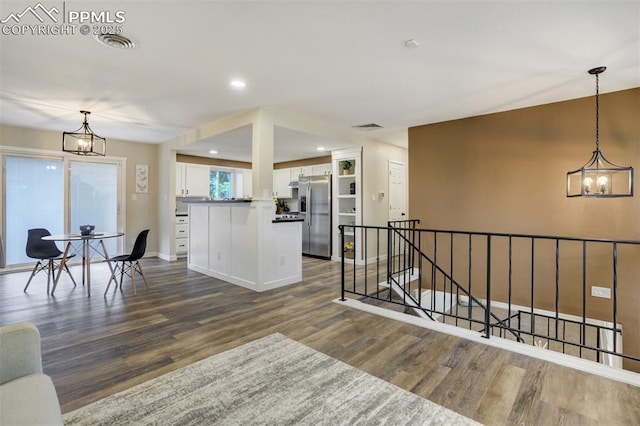 3905 Allgood Dr, Colorado Springs, CO 80911 - living room featuring a chandelier, dark wood-style floors, baseboards, and recessed lighting