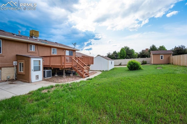 3905 Allgood Dr, Colorado Springs, CO 80911 - rear view of property featuring a wooden deck, stairway, central AC, stucco siding, and a patio