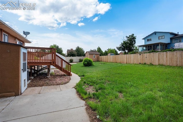 3905 Allgood Dr, Colorado Springs, CO 80911 - view of yard featuring a wooden deck, a patio area, and stairway