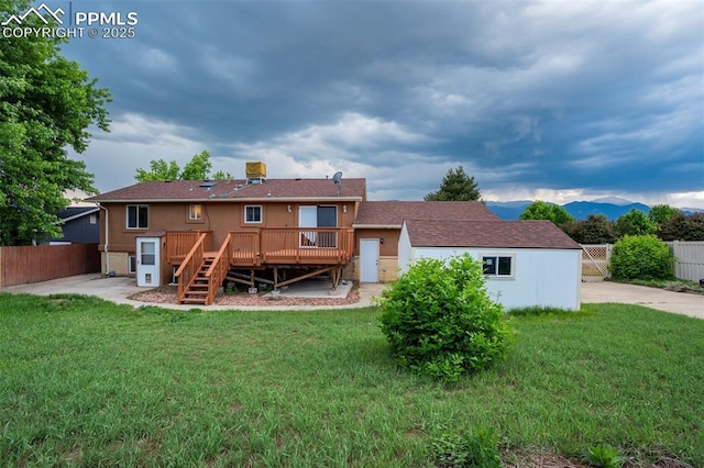 3905 Allgood Dr, Colorado Springs, CO 80911 - back of house with a deck with mountain view, stairs, and a patio