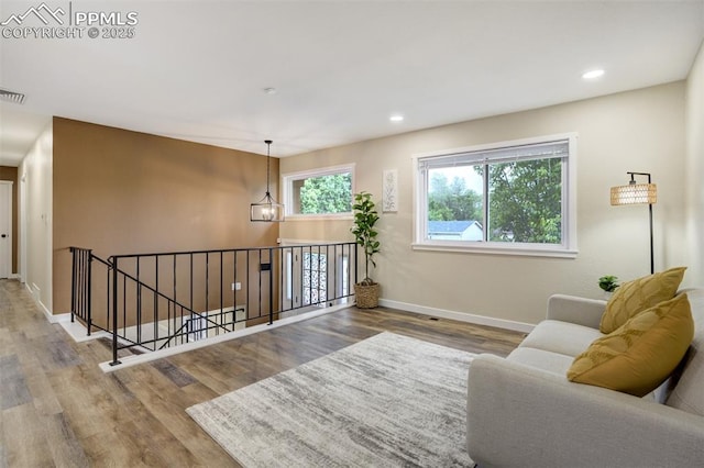 3905 Allgood Dr, Colorado Springs, CO 80911 - living area featuring wood finished floors, baseboards, and recessed lighting