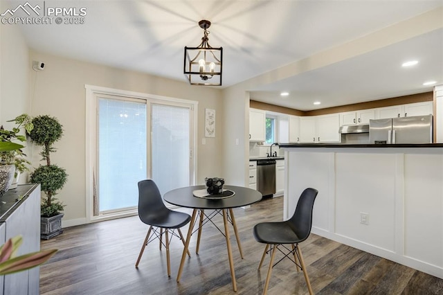 3905 Allgood Dr, Colorado Springs, CO 80911 - dining room featuring dark wood-style flooring, a chandelier, recessed lighting, and baseboards