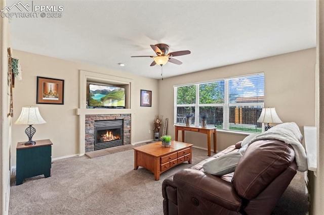 4298 Apache Plume Dr, Colorado Springs, CO 80920 - living room with a ceiling fan, carpet flooring, a stone fireplace, and baseboards