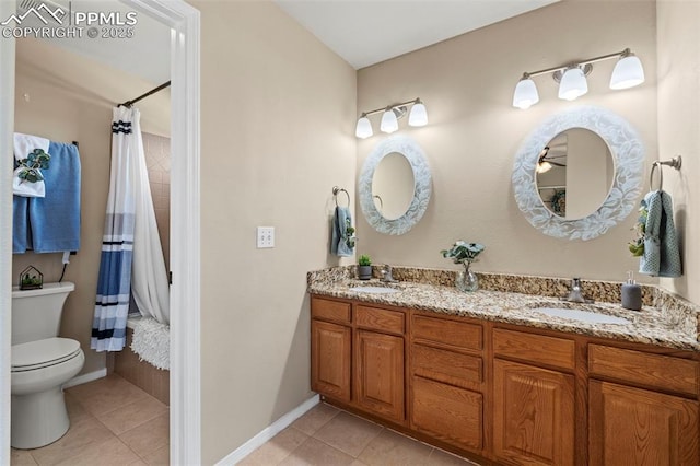 4298 Apache Plume Dr, Colorado Springs, CO 80920 - bathroom with tile patterned floors, toilet, double vanity, and baseboards