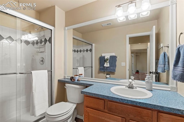 4298 Apache Plume Dr, Colorado Springs, CO 80920 - bathroom featuring a shower stall, vanity, and toilet