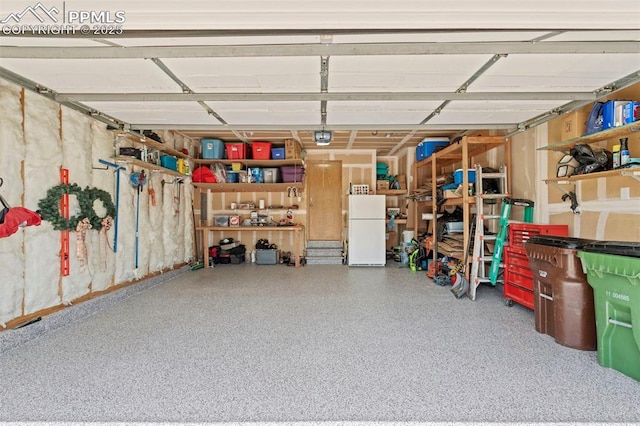 4298 Apache Plume Dr, Colorado Springs, CO 80920 - garage with freestanding refrigerator