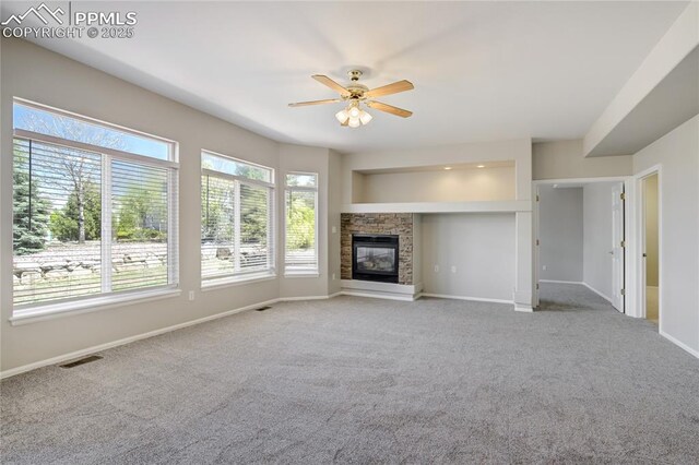 1264 Castle Hills Pl, Colorado Springs, CO 80921 - unfurnished living room with ceiling fan, carpet, and baseboards