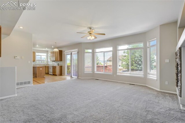 1264 Castle Hills Pl, Colorado Springs, CO 80921 - unfurnished living room featuring light carpet, ceiling fan, baseboards, and recessed lighting