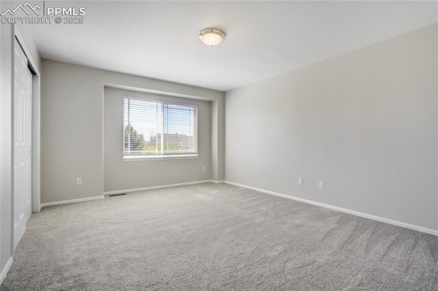 1264 Castle Hills Pl, Colorado Springs, CO 80921 - unfurnished bedroom with carpet flooring, baseboards, and a closet