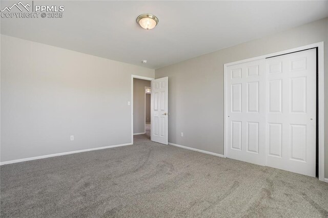 1264 Castle Hills Pl, Colorado Springs, CO 80921 - unfurnished bedroom featuring carpet flooring, baseboards, and a closet