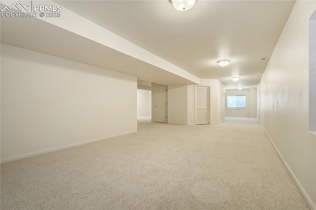 1264 Castle Hills Pl, Colorado Springs, CO 80921 - basement with light carpet and baseboards
