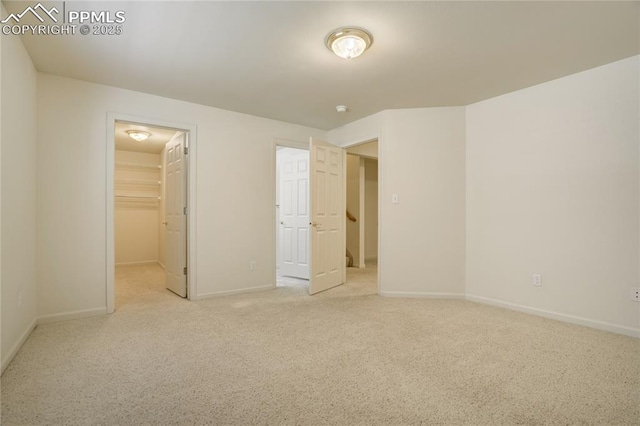 1264 Castle Hills Pl, Colorado Springs, CO 80921 - unfurnished bedroom with carpet floors, a spacious closet, and baseboards