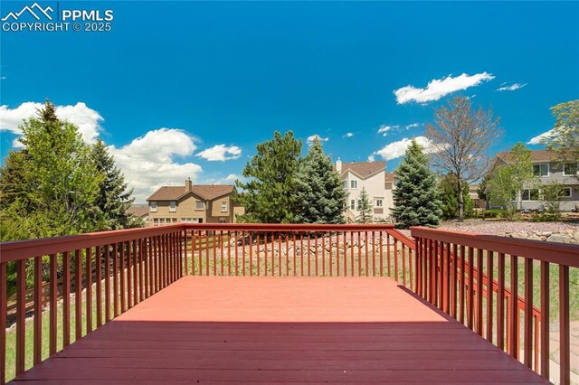 1264 Castle Hills Pl, Colorado Springs, CO 80921 - wooden terrace featuring a residential view