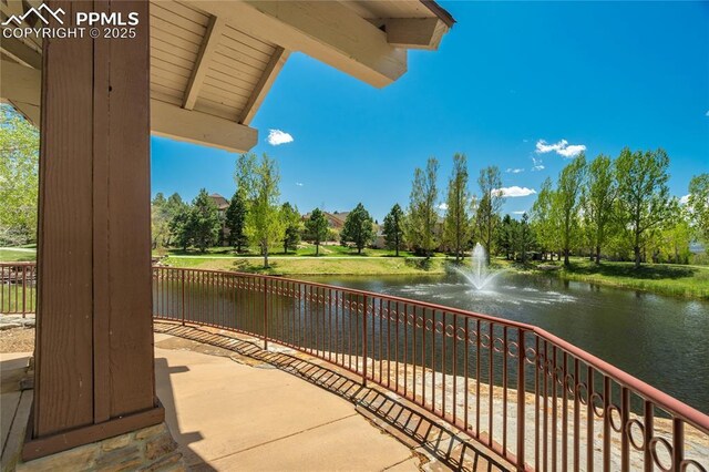 1264 Castle Hills Pl, Colorado Springs, CO 80921 - view of patio / terrace featuring a water view and view of scattered trees