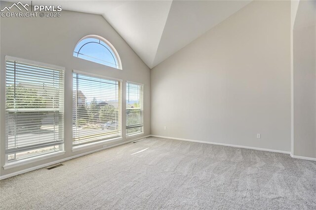 1264 Castle Hills Pl, Colorado Springs, CO 80921 - spare room featuring vaulted ceiling, carpet, and baseboards