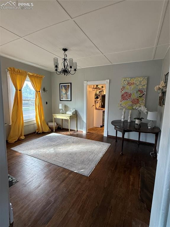 2932 W Kiowa St, Colorado Springs, CO 80904 - dining room with wood finished floors, a chandelier, and baseboards
