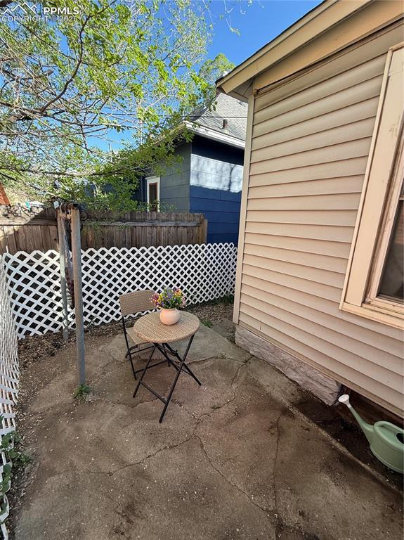 2932 W Kiowa St, Colorado Springs, CO 80904 - view of property exterior featuring a patio area and fence