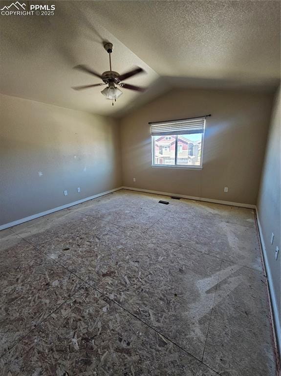 6282 Pilgrimage Rd, Colorado Springs, CO 80925 - empty room with a textured ceiling, a ceiling fan, baseboards, and lofted ceiling