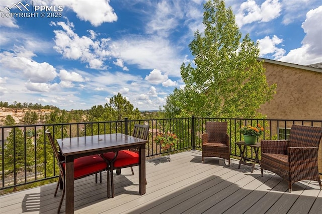 wooden deck with outdoor dining area