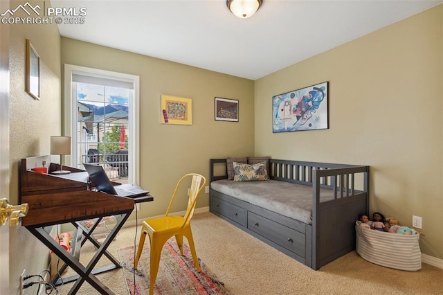 bedroom featuring a desk, carpet, and baseboards