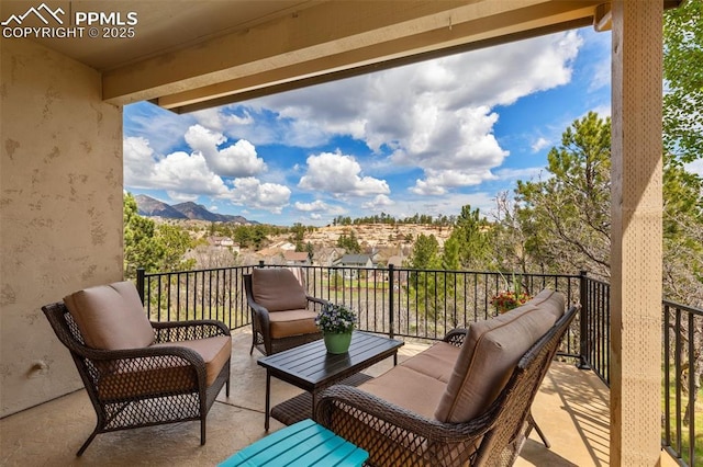 balcony featuring outdoor lounge area and a mountain view