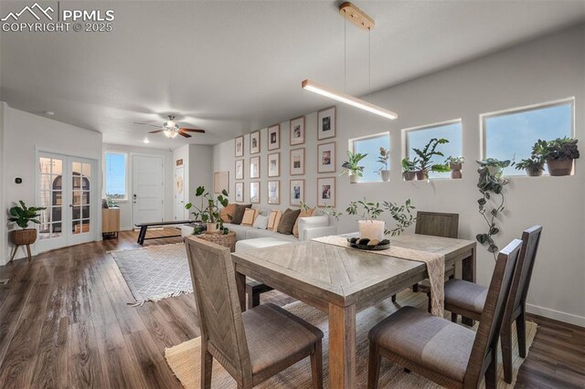 7907 Tremble Pt, Colorado Springs, CO 80908 - dining room with dark wood-type flooring, ceiling fan, french doors, and baseboards