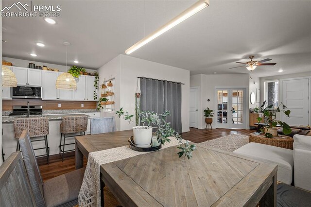 7907 Tremble Pt, Colorado Springs, CO 80908 - dining area with wood finished floors, ceiling fan, and recessed lighting