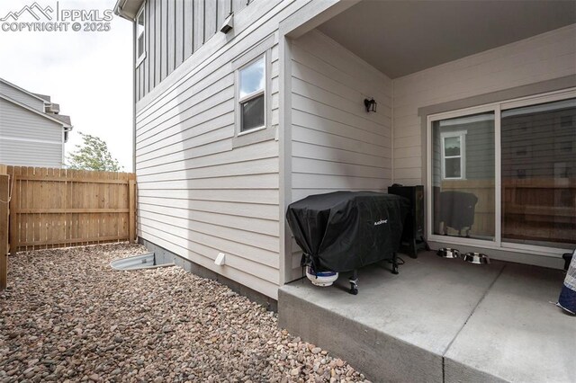 7907 Tremble Pt, Colorado Springs, CO 80908 - view of patio featuring fence and a grill
