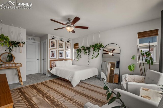 7907 Tremble Pt, Colorado Springs, CO 80908 - carpeted bedroom with a ceiling fan