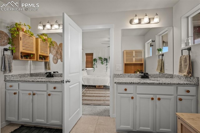 7907 Tremble Pt, Colorado Springs, CO 80908 - ensuite bathroom featuring tile patterned flooring and two vanities
