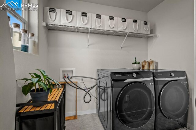 7907 Tremble Pt, Colorado Springs, CO 80908 - laundry area featuring washer and clothes dryer and baseboards