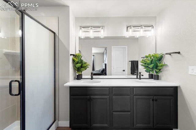 11456 Sanderling St, Colorado Springs, CO 80925 - full bath featuring double vanity, a stall shower, and ensuite bathroom