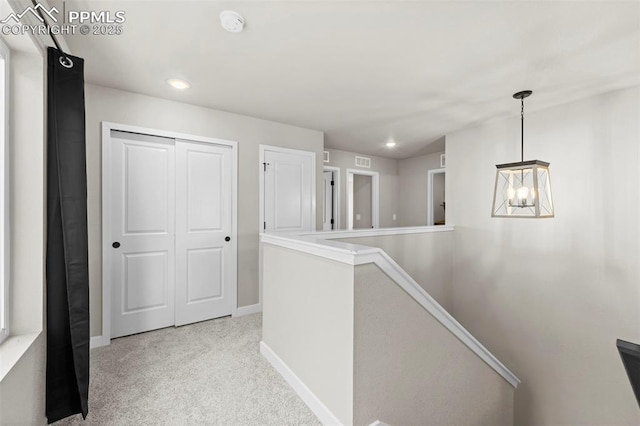 11456 Sanderling St, Colorado Springs, CO 80925 - corridor with an upstairs landing, a chandelier, baseboards, light carpet, and recessed lighting