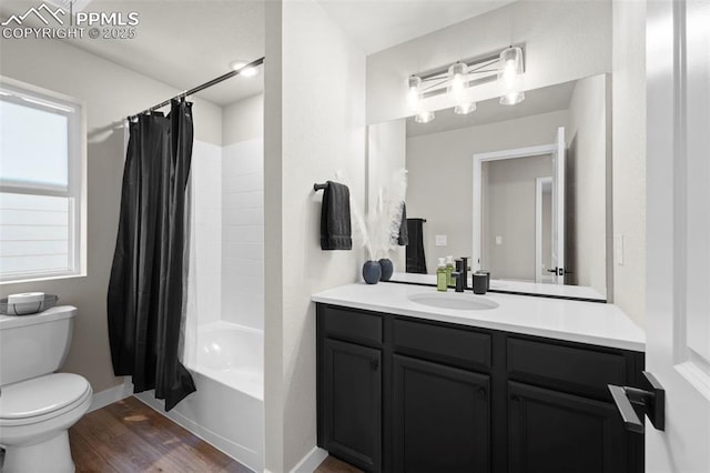 11456 Sanderling St, Colorado Springs, CO 80925 - bathroom featuring vanity, toilet, wood finished floors, shower / tub combo with curtain, and baseboards
