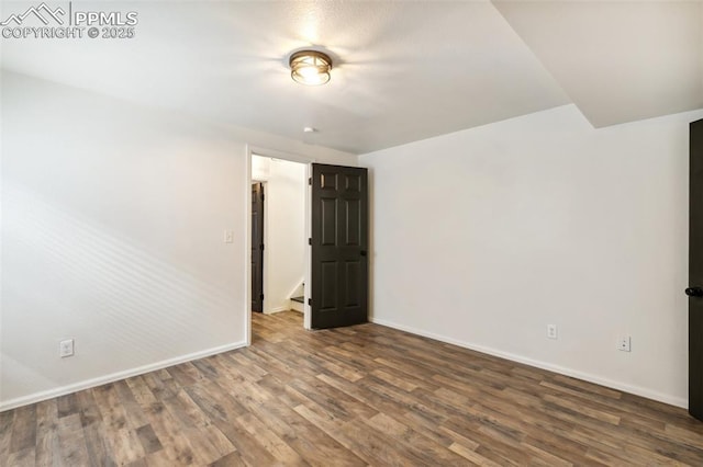 5048 Pathfinder Dr, Colorado Springs, CO 80911 - spare room featuring baseboards and wood finished floors