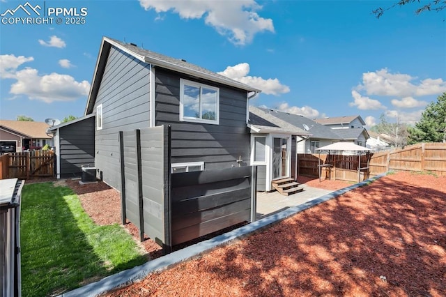 5048 Pathfinder Dr, Colorado Springs, CO 80911 - rear view of house featuring entry steps, a fenced backyard, and a patio area